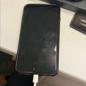 Apple Black Smartphone with White Charger